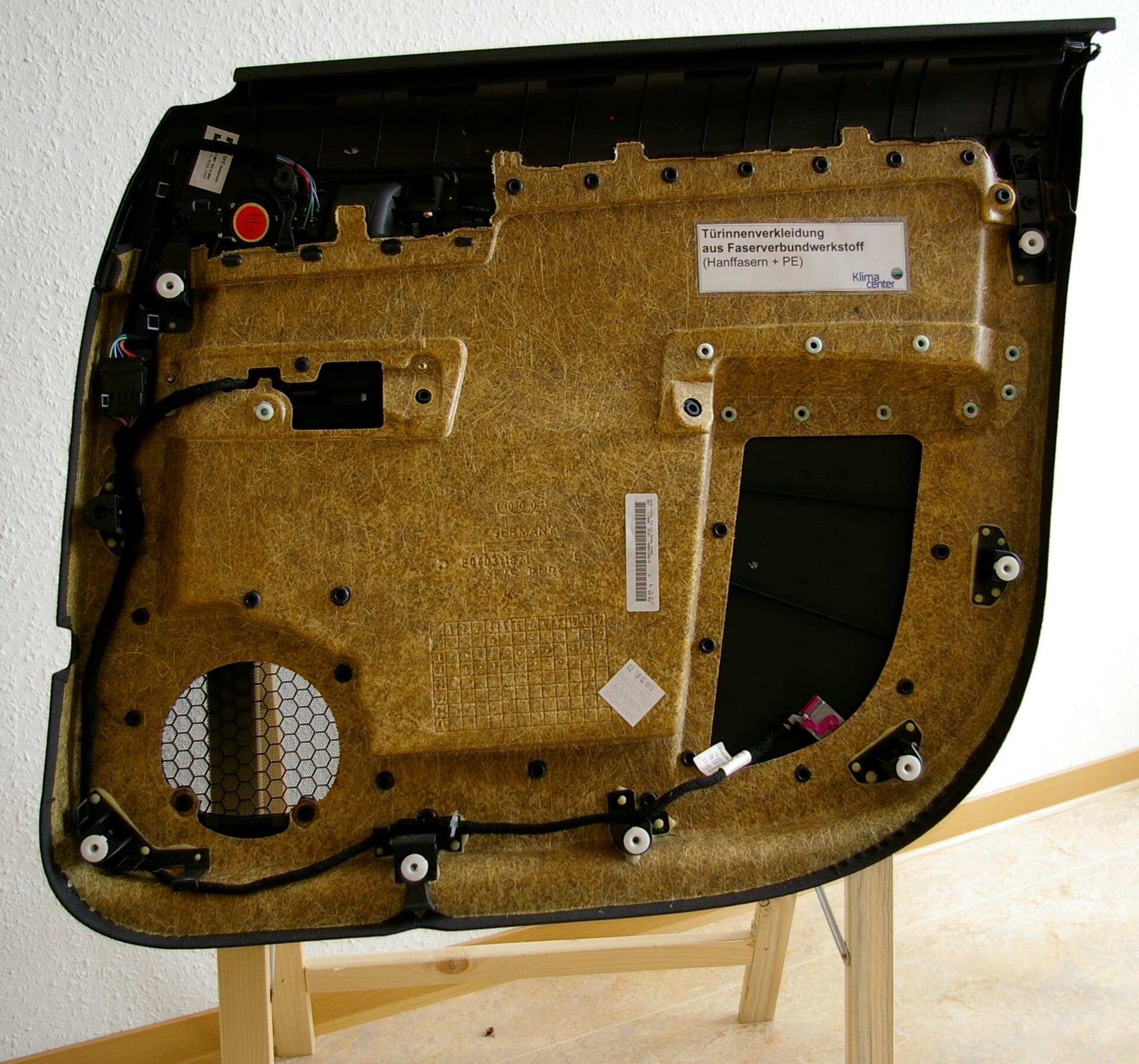 Natural fiber reinforced polymer composite panel for automotive interiors