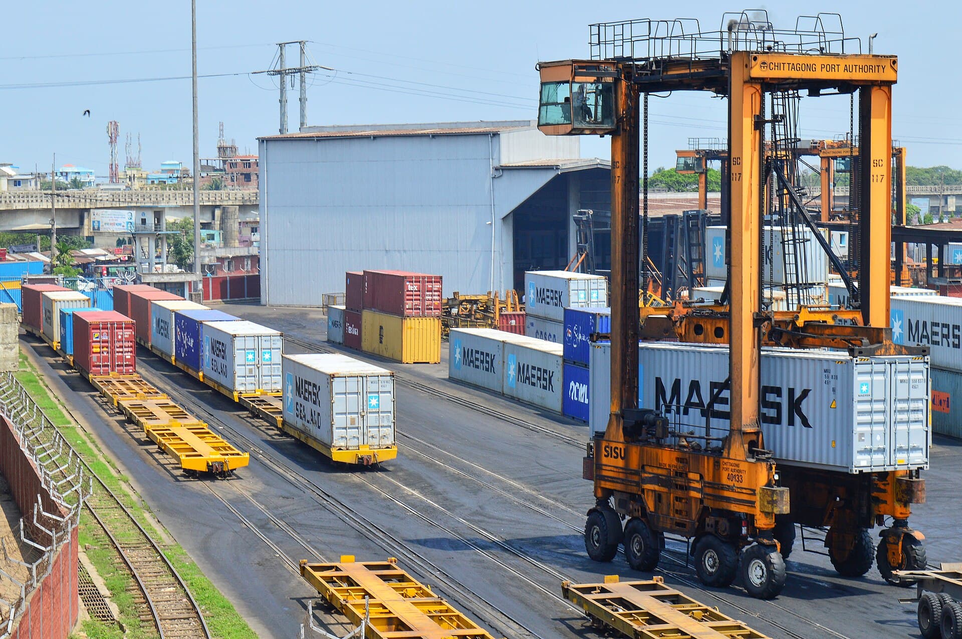 Container port in Chittagong, Bangladesh, at dusk — export shipments leaving for worldwide buyers